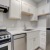 a kitchen with white cabinets